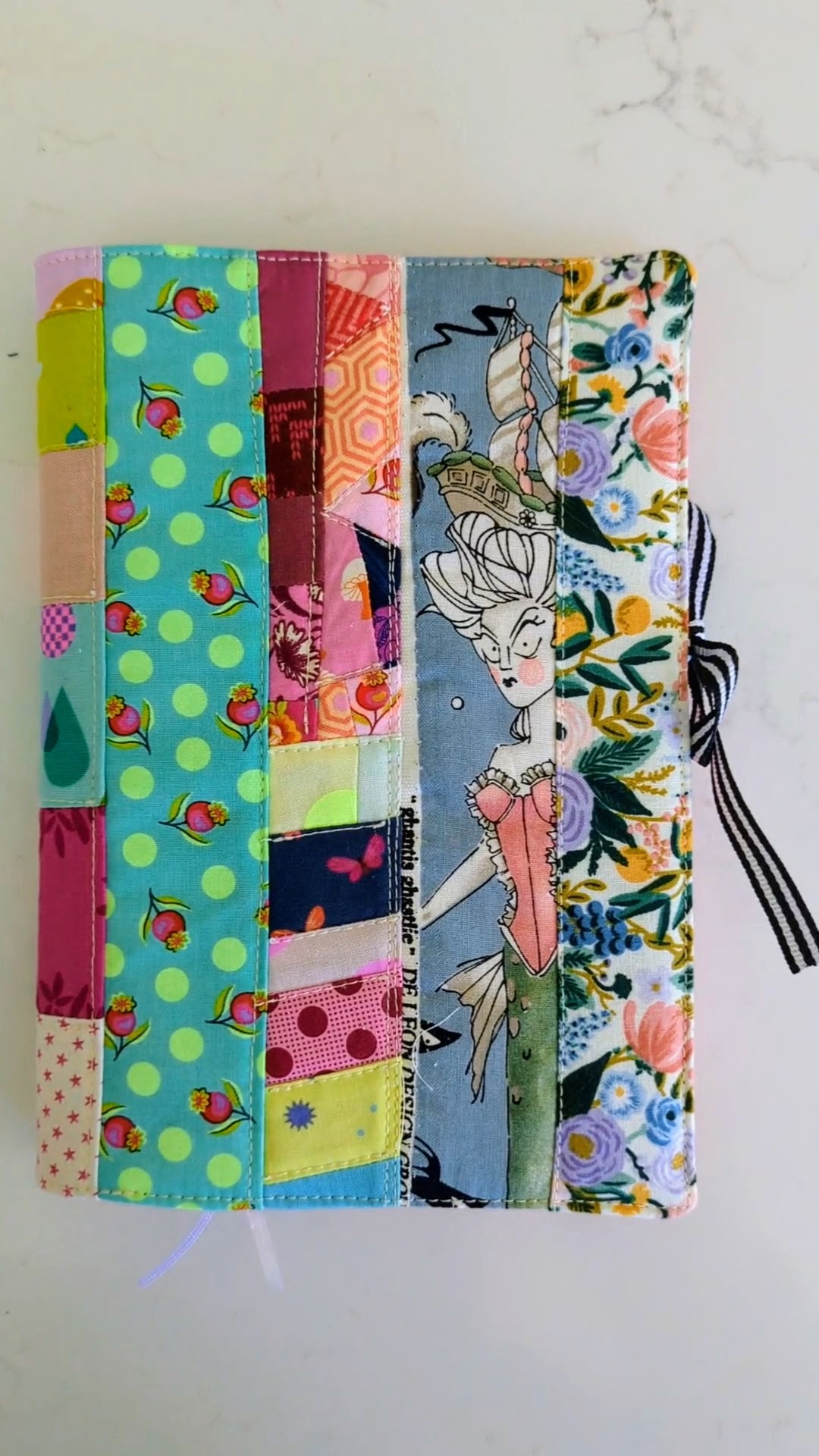 Quilted patchwork book sleeve handmade by Salty Bee Threads