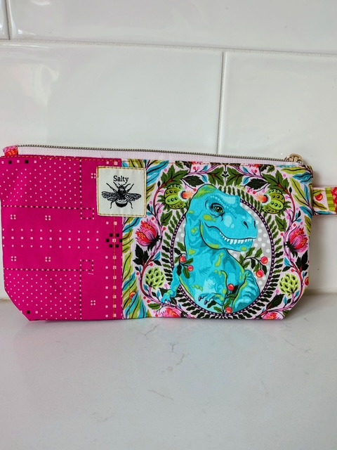 Dinosaur print zipper pouch handmade by Salty Bee Threads